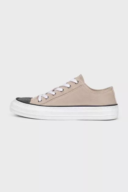 Suede sneakers with a decorated toe