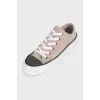Suede sneakers with a decorated toe