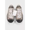 Suede sneakers with a decorated toe
