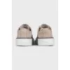 Suede sneakers with a decorated toe