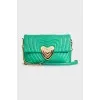 Green shoulder bag with a heart