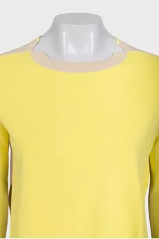 A suit consisting of a jumper with slits and trousers