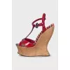 Red sandals with a figured wedge heel