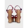 Red sandals with a figured wedge heel
