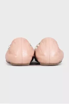 Pink leather ballet flats with decoration