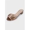 Leather flip-flops with heels and a bow