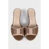 Leather flip-flops with heels and a bow