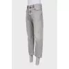 Men's gray jeans with distressed pockets