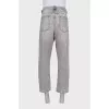 Men's gray jeans with distressed pockets