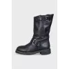 Black boots with adjustable buckle