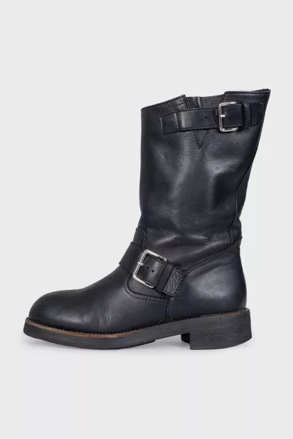 Black boots with adjustable buckle