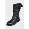 Black boots with adjustable buckle