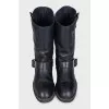 Black boots with adjustable buckle