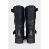 Black boots with adjustable buckle