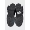 Black boots with adjustable buckle