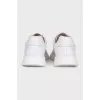 Men's white sneakers with logo