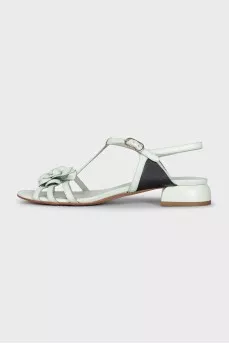 Blue leather sandals decorated with a flower