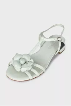Blue leather sandals decorated with a flower