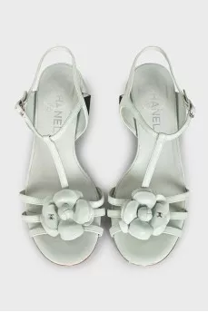 Blue leather sandals decorated with a flower