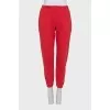 Red sweatshirt and tapered trousers suit