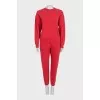 Red sweatshirt and tapered trousers suit