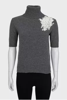 Wool sweater decorated with lace