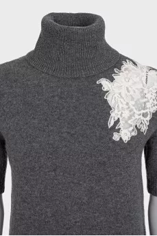 Wool sweater decorated with lace