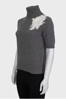 Wool sweater decorated with lace