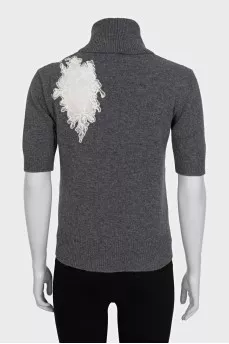 Wool sweater decorated with lace