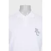 Men's white polo shirt with a patch