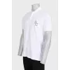 Men's white polo shirt with a patch