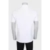 Men's white polo shirt with a patch