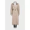 Trench coat with a buttoned belt