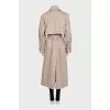 Trench coat with a buttoned belt