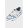 Light blue sneakers with a signature print