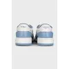 Light blue sneakers with a signature print