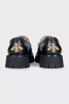Leather loafers with embroidered heel