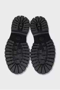 Leather loafers with embroidered heel