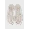 White leather lace-up sneakers