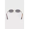 Oval sunglasses with gold hardware