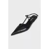 Black pointed-toe slingbacks