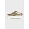 Gold sneakers with white soles