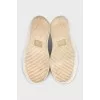 Gold sneakers with white soles