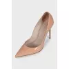 Beige patent leather pumps