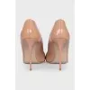 Beige patent leather pumps
