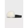 Black flip-flops with white fur
