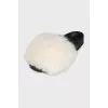 Black flip-flops with white fur