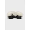 Black flip-flops with white fur