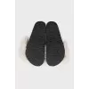 Black flip-flops with white fur