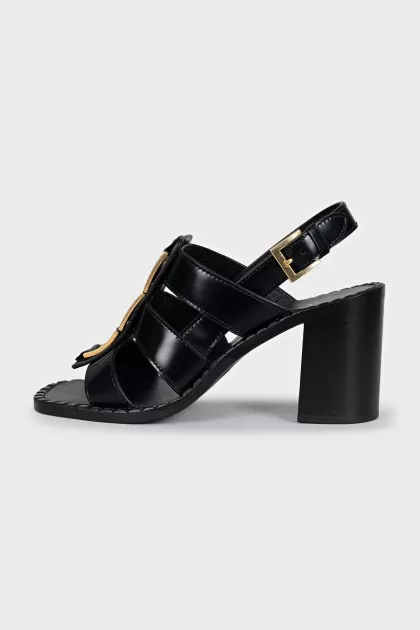 Black heeled sandals with gold hardware